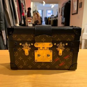 Louis Vuitton Petit Malle or “Little Trunk.”